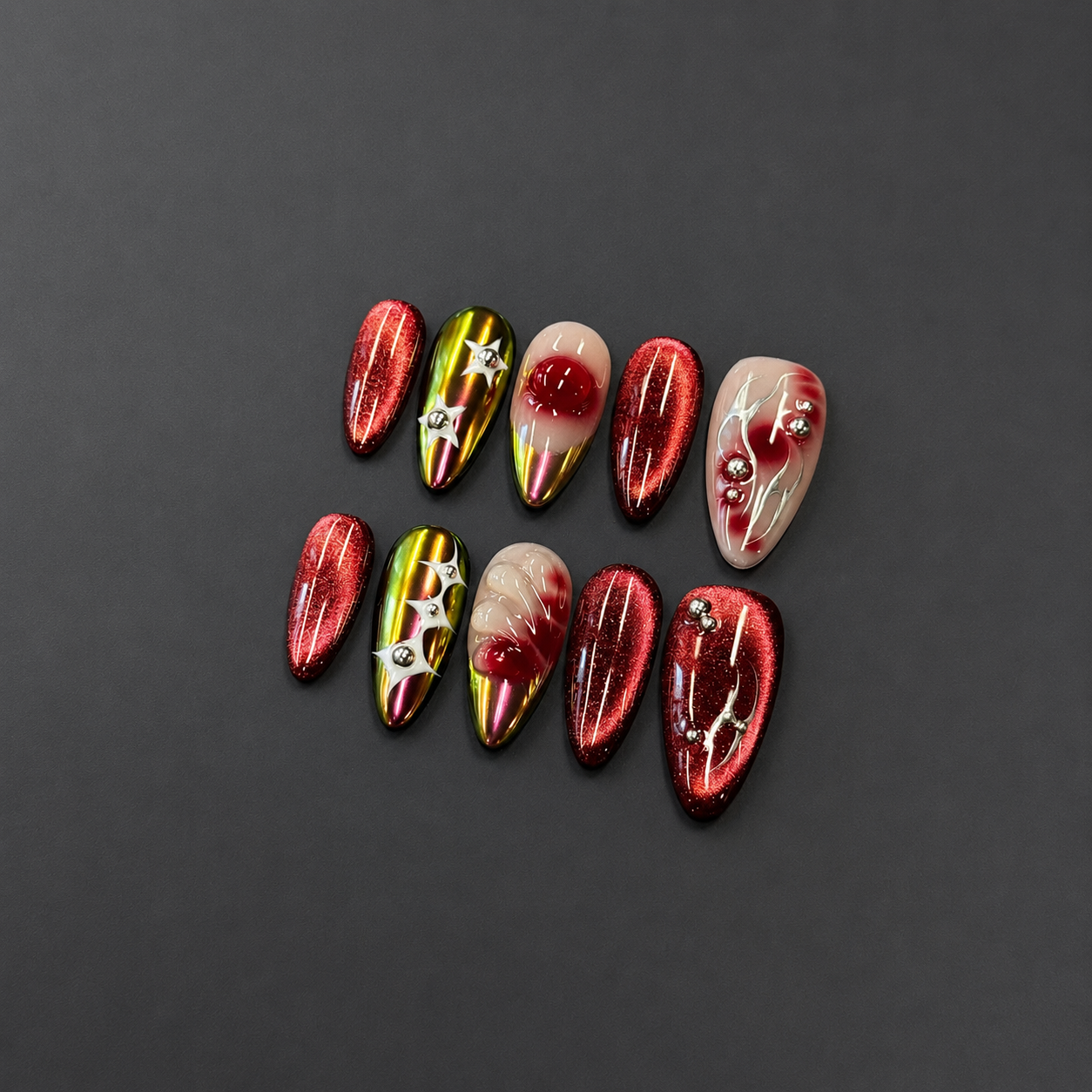 Ruby Chrome Star Nails - Almond Press-On Nails with Red Cat Eye, Silver Stars and Rhinestone Details
