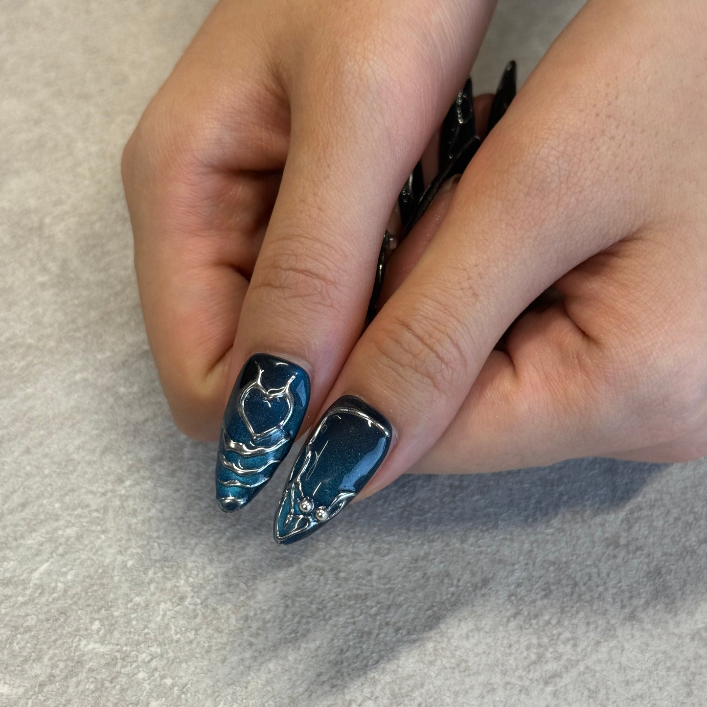 Midnight Steel Chrome Nails | Almond Cat Eye Press-On Nails with Silver Web & Blue Rhinestone Details